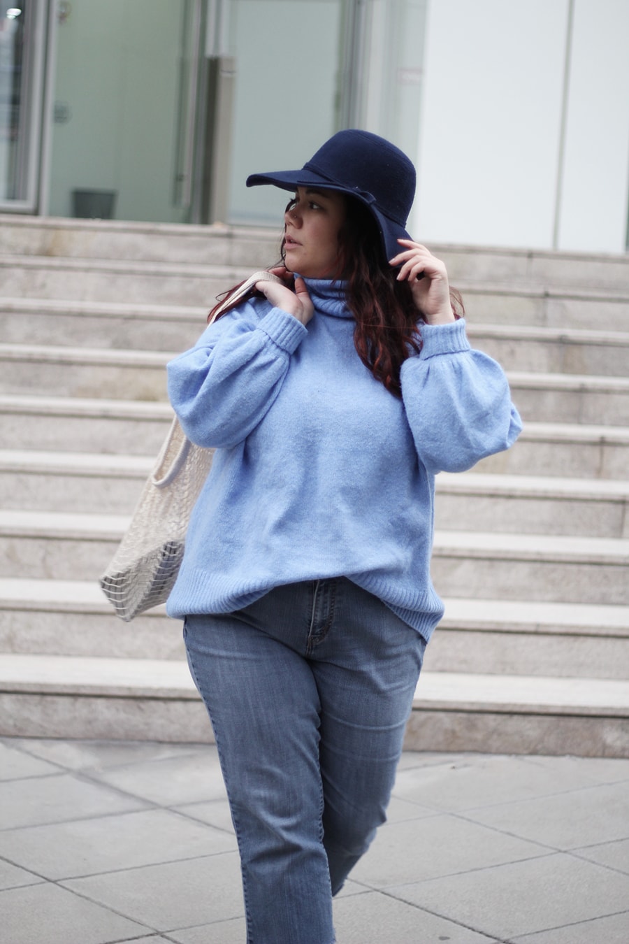 Blue turtle neck sweater - net bag trend - cowboy boots - plus size winter outfit