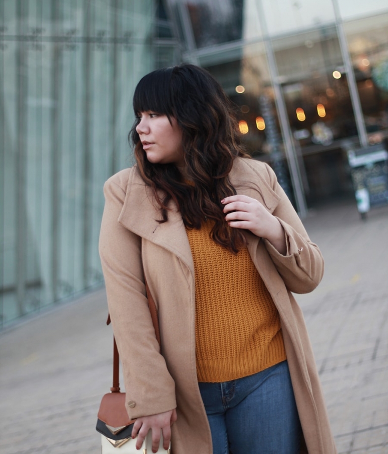 Long nude coat and a mustard sweater
